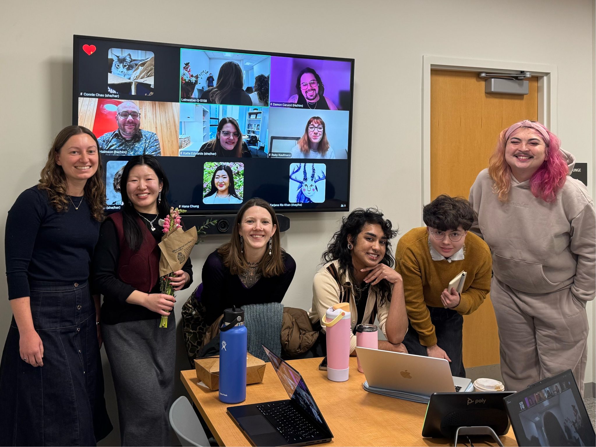 A photo of Hana Chung, her committee members, and many friends/peers attending her pre-candidacy oral defense