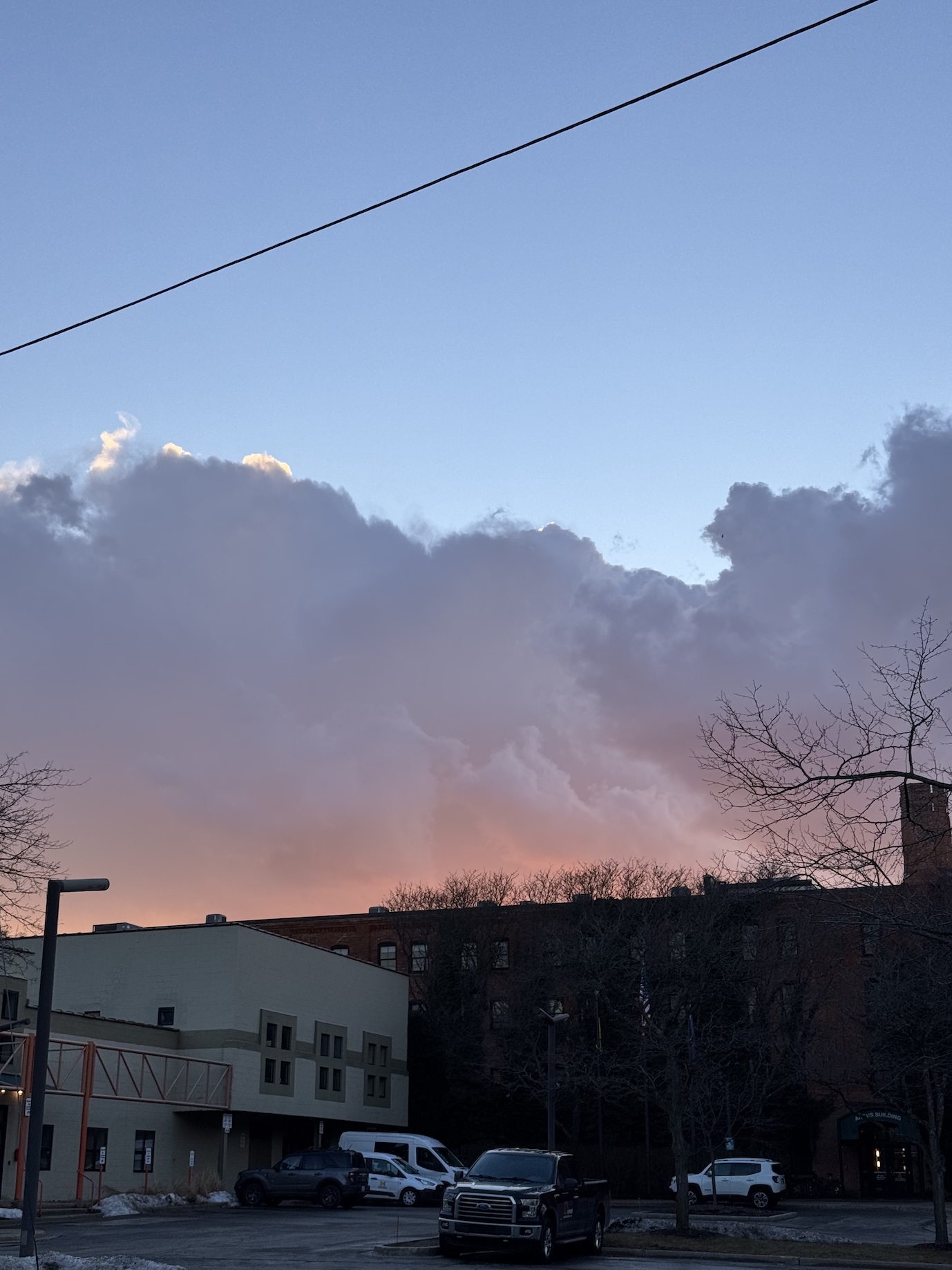 Large, pink & purple rain clouds in the sunset.
