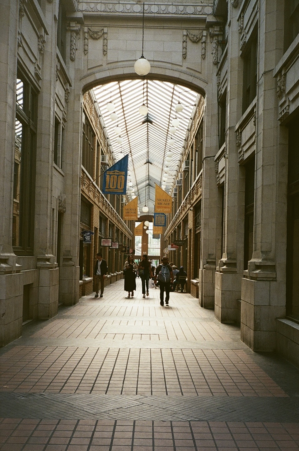 A photo of Nickels Arcade, an old mosaic-tiled covered shopping corridor in downtown Ann Arbor.