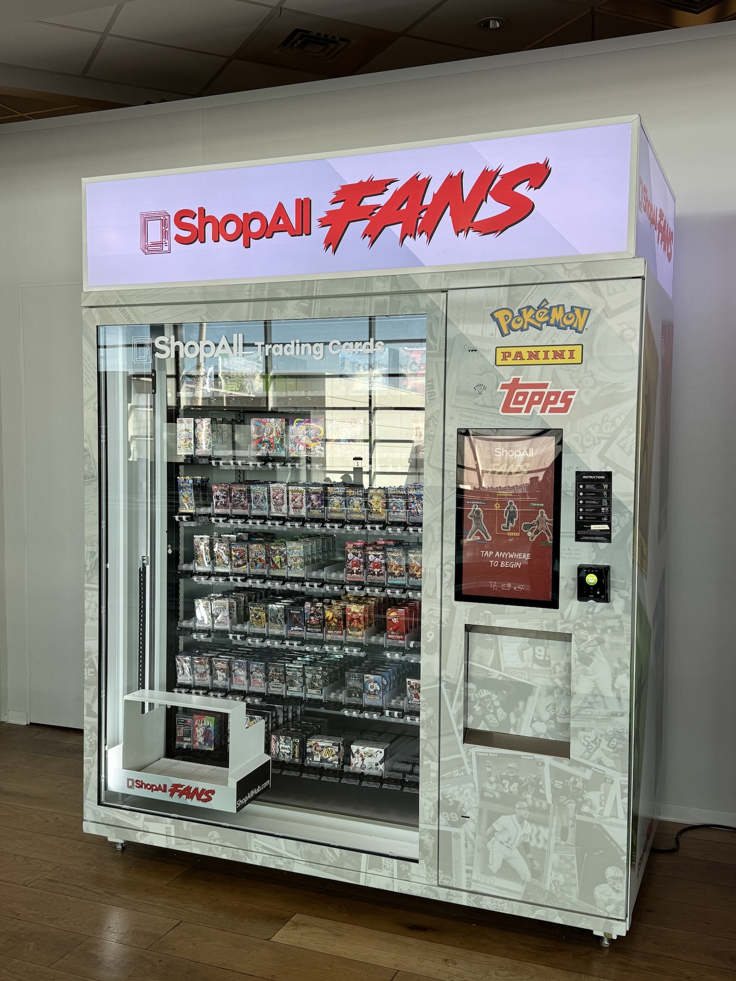 A dispenser machine filled with trading card packs.