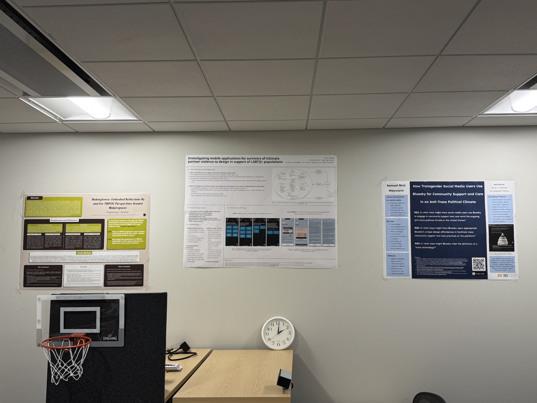 A photo of Ria, Hana, and I's research posters.